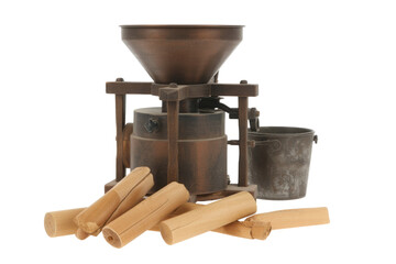 Antique wooden and metal grain mill with hopper and bucket, surrounded by logs. background removed