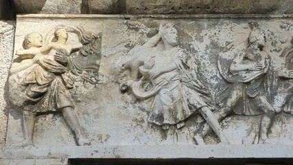 Rome, Italy – 13 January 2025. At Basilica Emilia, a carved panel captures the Rape of the Sabine...