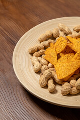 Peanut Butter and Chips on a Wooden Plate on a Wooden Table