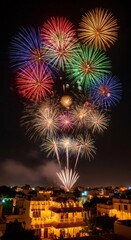 Colorful Diwali fireworks exploding above a beautifully lit up house and cityscape at night for celebration and festivity.