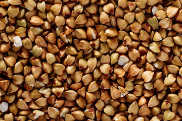 Green buckwheat kernels close-up texture, food background