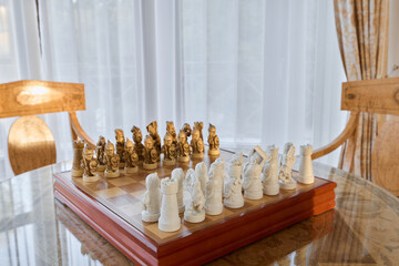 An Elegant Chess Set Creatively Displayed in a Bright and Inviting Room Environment