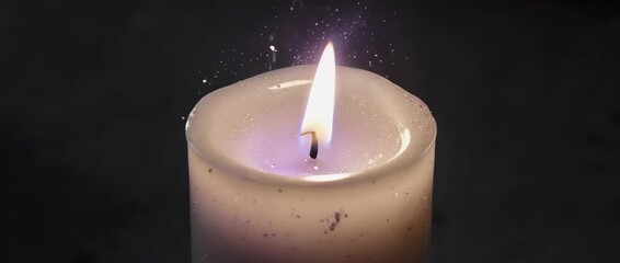 A softly flickering candle in the dark, symbolizing remembrance for those lost and a beacon of hope for the future. A solemn, respectful background for memorials.