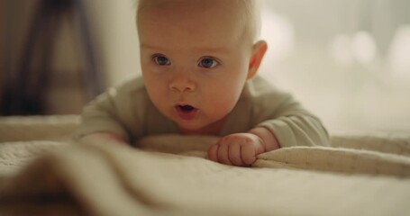 Close-Up of Baby Crawling on Blanket