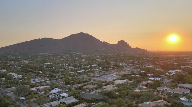 Drone aerial footage of Scottsdale and Phoenix at sunset, featuring Camelback Mountain