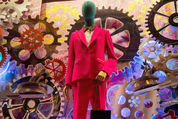 Female mannequin in an elegant suit in a showcase of original design