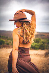 woman with hat exploring algarve nature landscape