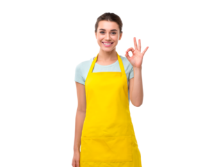 Smiling woman making ok gesture in bright yellow apron