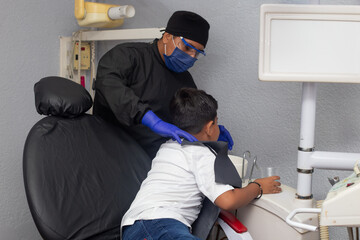 dentist working with a child patient
