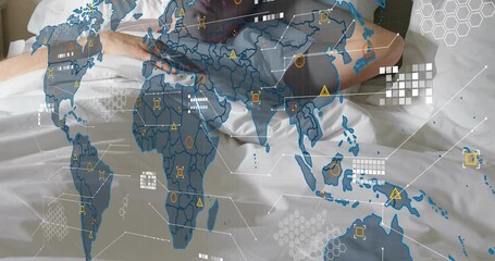 Overlay intensifying over bed, man emerging from sheet under world map animating technology network - Powered by Adobe