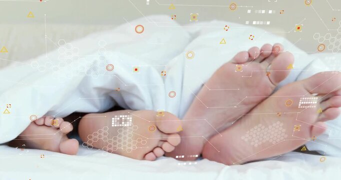 Digital overlay sparking child feet wiggling under duvet, toes wrapping adult foot before settling