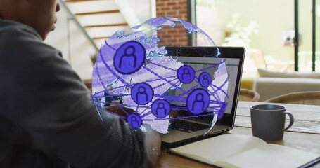 Man typing and scrolling trackpad in tech hub, causing globe spinning and highlighting connectivity - Powered by Adobe