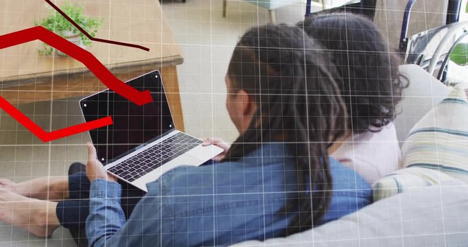Man and woman lifting laptop, analyzing animated financial graph overlaying grid on sofa background - Powered by Adobe