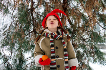 a little girl in an elf costume in the fores