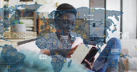 woman reading marbled book on sofa, animating world map with data icons overlay in technology demo - Powered by Adobe