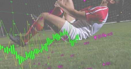 Experiencing shin pain soccer athlete lifting torso under lights while engaging animated analytics - Powered by Adobe