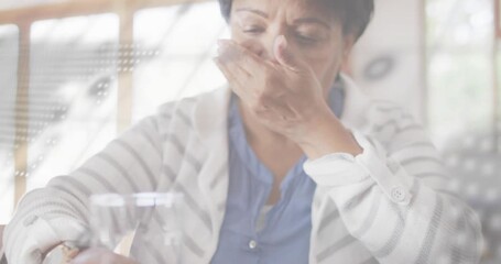 Senior woman sipping water to soothe throat after irritation while code overlay shifting in health - Powered by Adobe