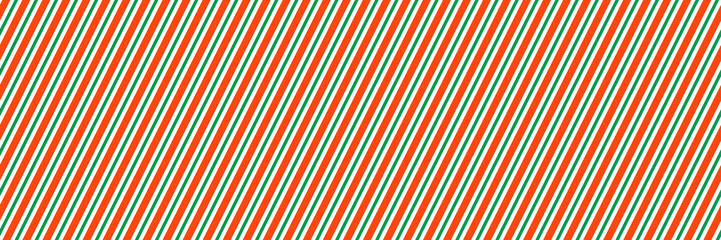 Striped candy cane Christmas seamless pattern. Red and green diagonal lines wallpaper. Winter holiday present wrapping paper. Xmas peppermint repeating background. Vector gift decoration backdrop