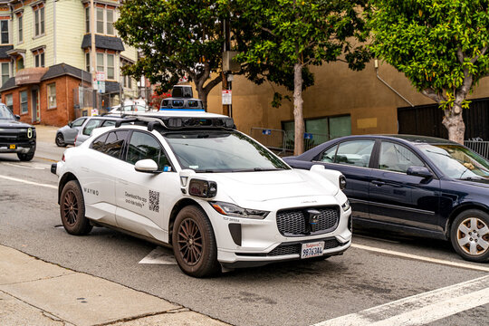 Waymo self-driving car operating on city streets in San Francisco