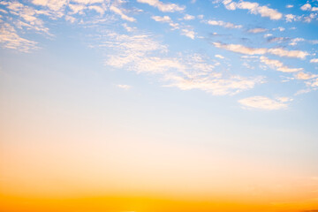 Fototapeta premium Beautiful , luxury soft gradient orange gold clouds and sunlight on the blue sky perfect for the background, take in evening,Twilight, Large size, high definition landscape photo