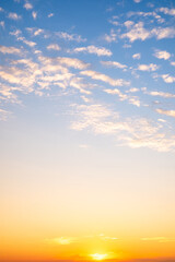 Beautiful , luxury soft gradient orange gold clouds and sunlight on the blue sky perfect for the background, take in evening,Twilight, Large size, high definition landscape photo,Vertical
