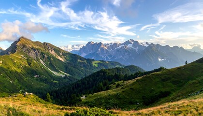 Fototapeta premium A sweeping vista of lush green hills and valleys cascading into a majestic mountain range, painted with vibrant hues of nature under a brilliant sky.