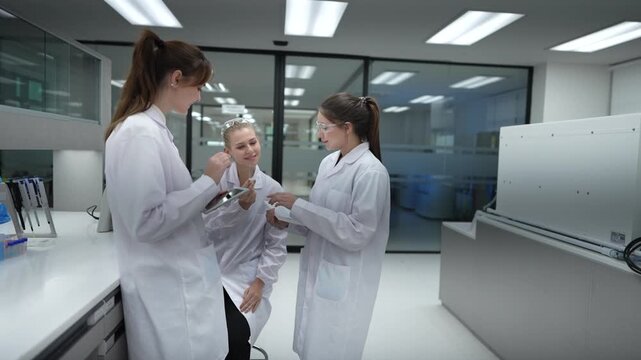 A clinical research team performs data validation, comparing a subject's results on a tablet with the official study protocol to ensure data integrity for a new drug trial.