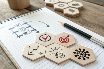Creative brainstorming session with wooden hexagonal tiles illustrating business concepts on a notepad