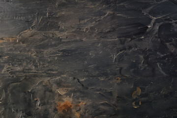 Textured dark slate stone background with natural minerals
