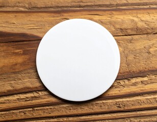 Blank white circle resting on rustic wooden surface