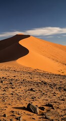 Sand Dune Majesty - A Desert Landscape Under a Blue Sky.