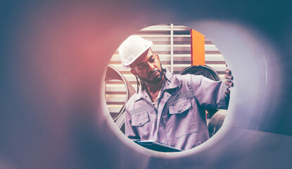 African american technician industrial worker inspecting aluminum metal sheet fabricating roll check stock materials in the steel coil storage area, rolls metal sheet high quality.