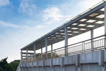 Fototapeta premium Pedestrian bridge against blue sky