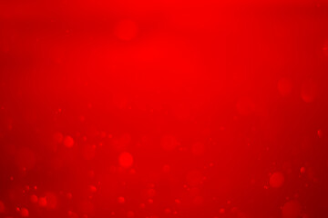 blurred red glitter vintage lights background. Red bokeh shiny on dark background.
