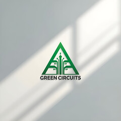 Green circuit board design forming a triangle, with the text "GREEN CIRCUITS" below, against a neutral background.