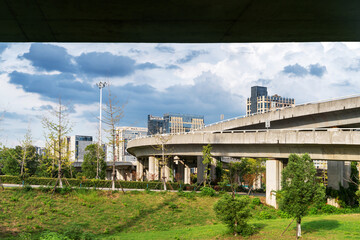 Concrete structure and asphalt road space under the overpass in the city
