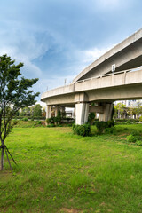 Obraz premium Concrete structure and asphalt road space under the overpass in the city