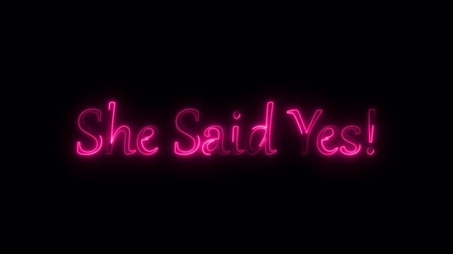 She said yes neon pink text against a dark background for engagement or wedding themes.