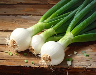 Three fresh, white onions with vibrant green scallions rest on a rustic wooden surface, showcasing a close-up view of their textures and colors.