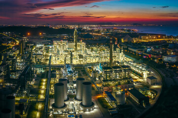 Chemical plant and oil refinery complex glowing at night.