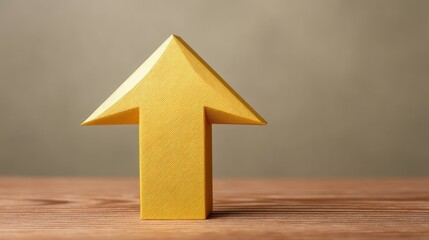 A vibrant yellow paper arrow pointing upwards, symbolizing growth, progress, and direction against a soft gradient background, ideal for motivational and business themes.