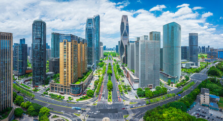 Wide avenue and modern cityscape with futuristic skyscrapers in the downtown financial district of...