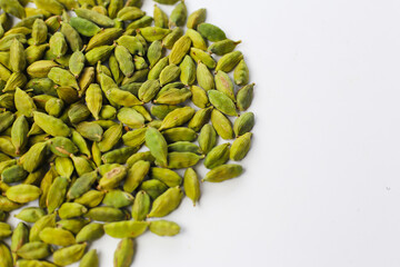 Green cardamom pods with aromatic and medicinal benefits.
