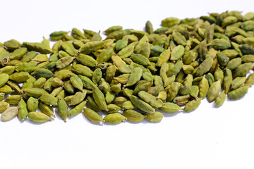 Green cardamom pods with aromatic and medicinal benefits.