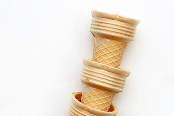 Empty wafer ice cream cones on a white background.
