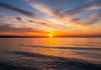 Obraz premium Golden Hour Serenity - A Tranquil Sunset Over the Ocean.