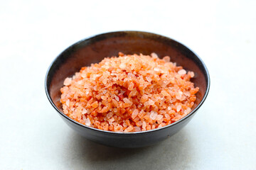 Pink Himalayan salt, Natural pink salt grains used for cooking.