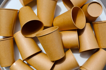 Brown paper cups on white background.
