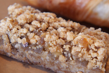 Enjoying a delicious homemade oat bar at a cozy bakery