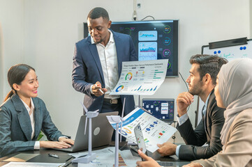 Manager Motivational teamwork officer by present document to colleagues decide. multiethnic coworker coach explain Analysis Statistics Report drawing presentation to business improvement teamwork